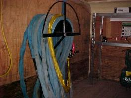 Heated hose on hose rack in mobile sprayfoam unit.